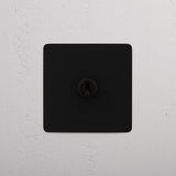 Interruptor articulado retrátil individual Bronze - Design de interruptor de luz fácil de usar em fundo branco